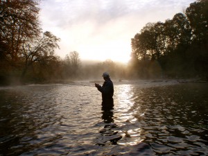 Angler and early morning fog on the Tuckasegee River